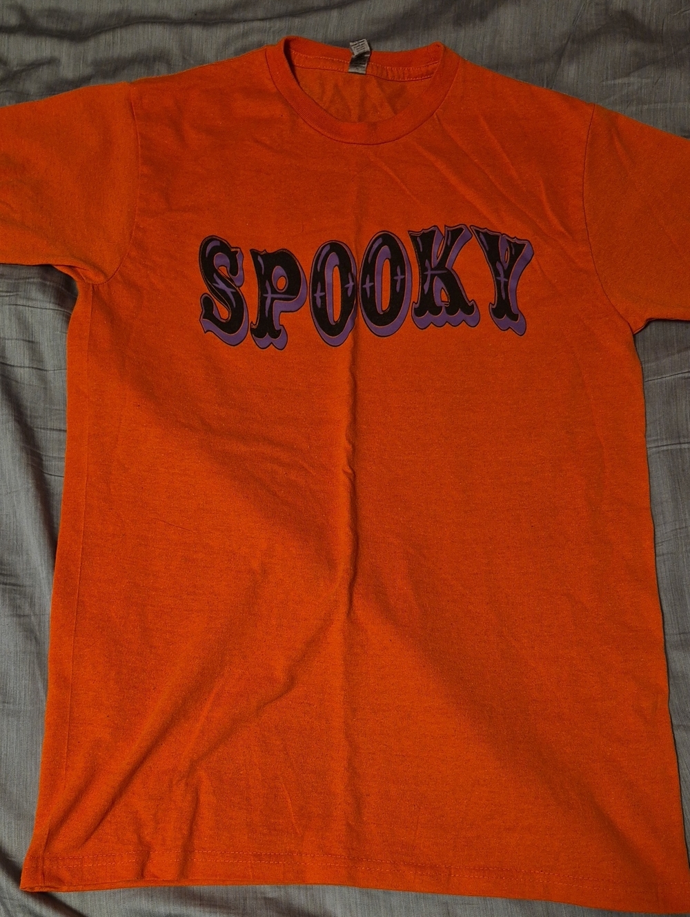 Spooky Orange Graphic Tee with Purple Lettering